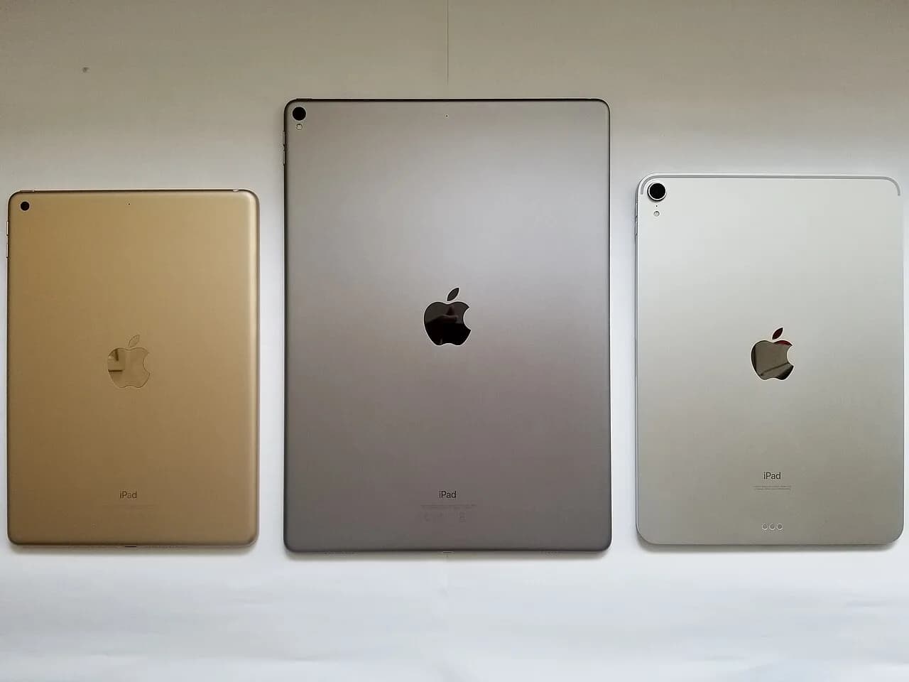 An iPad and an iPad Pro lying side by side