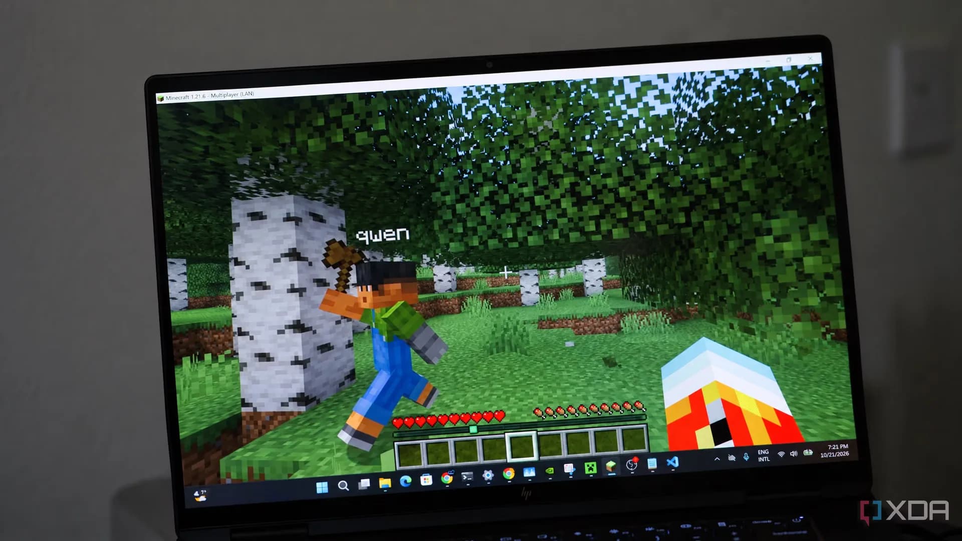 HP OmniBook Ultra 16 laptop with Nvidia RTX Spark running Minecraft alongside a local AI language model