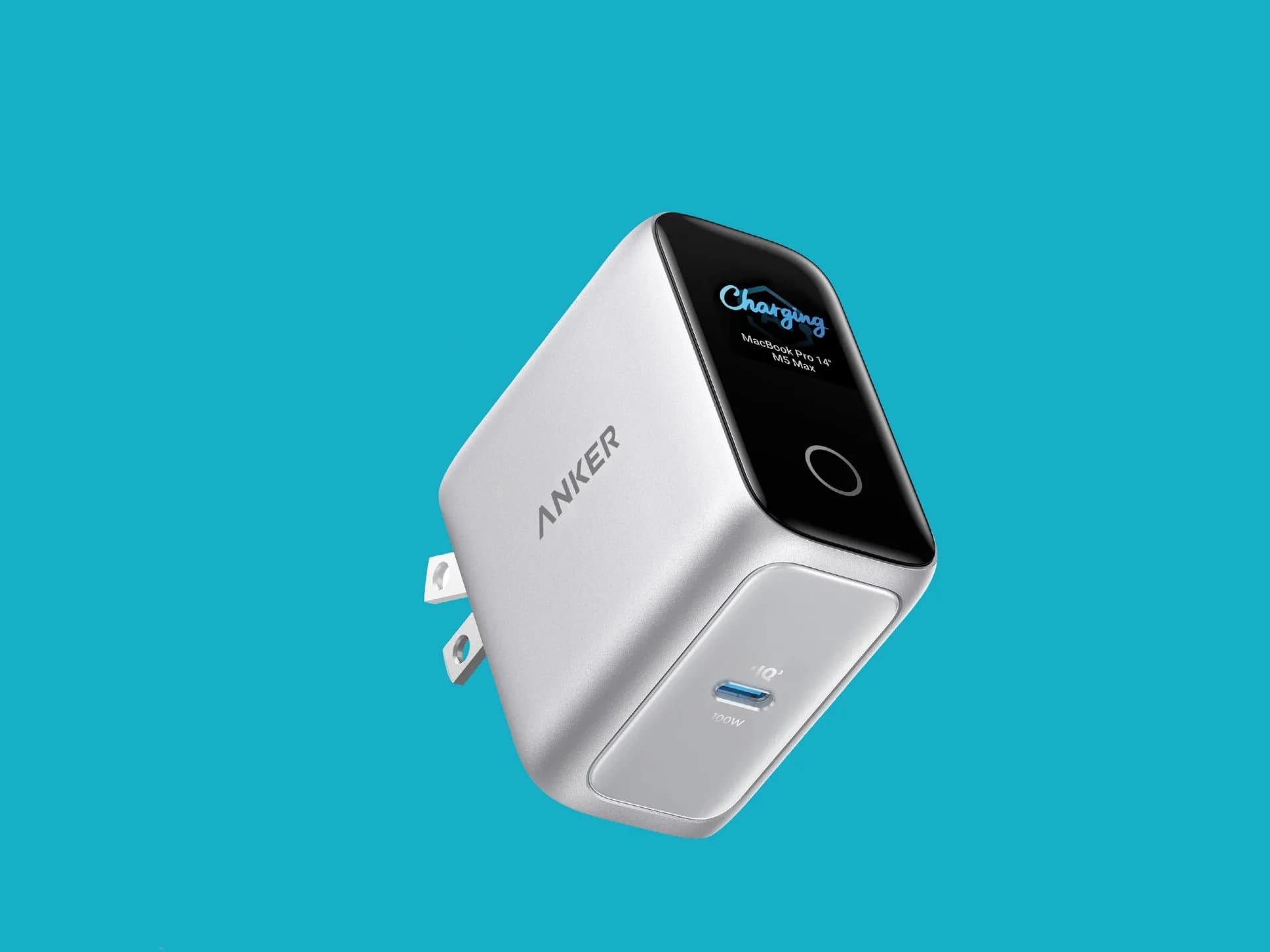 Anker Laptop Charger Pro, a compact white GaN charger with a small built-in display, shown with its folding prongs and single USB-C port.