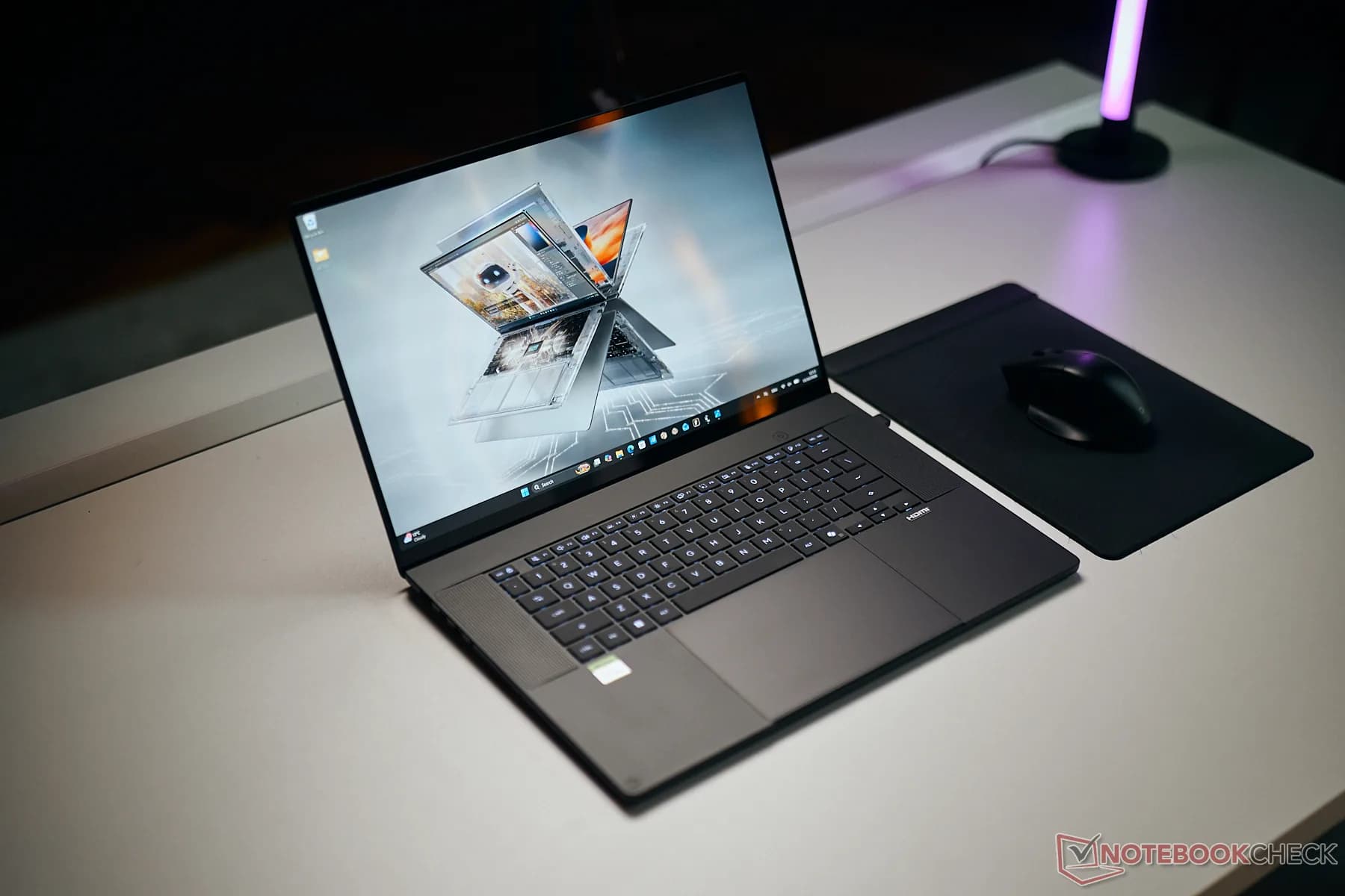 Nvidia RTX Spark N1X chip rendering next to an Apple MacBook Pro with M5 Pro chip
