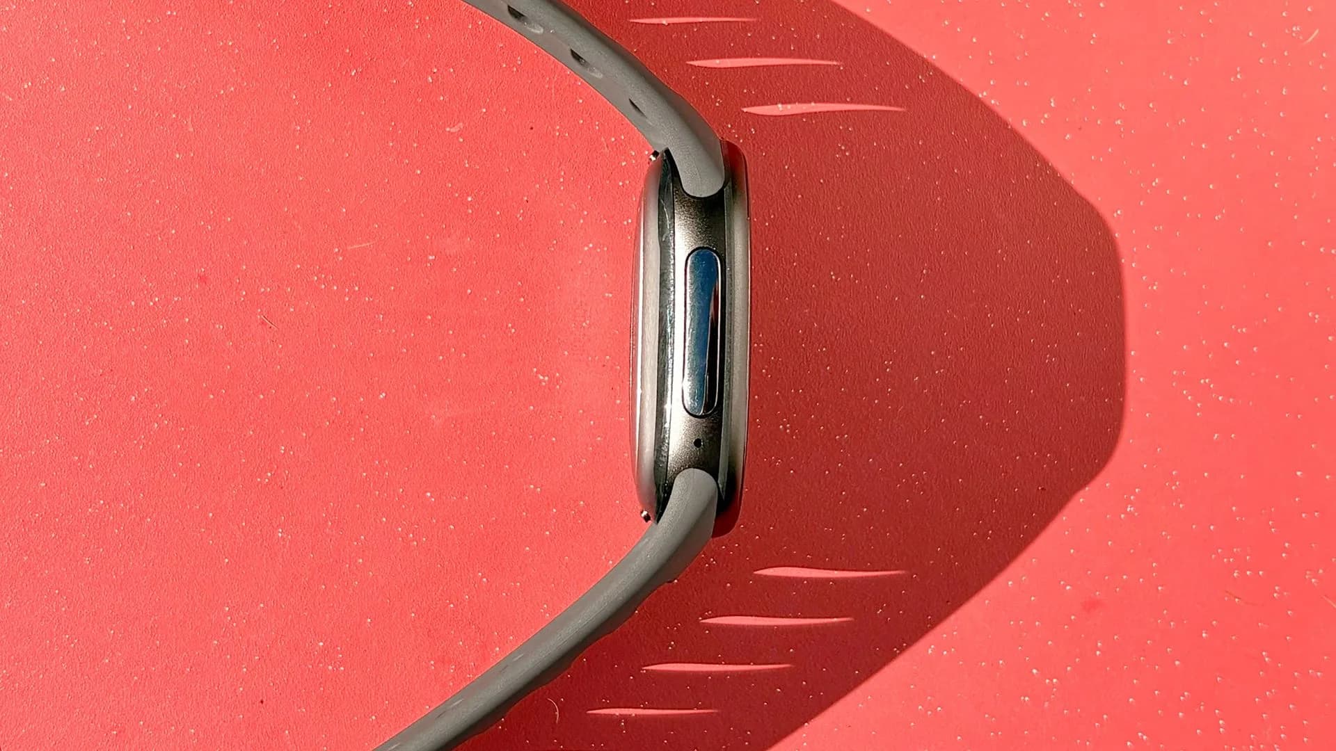 Google Fitbit Edge fitness tracker shown on a wrist display showing workout data