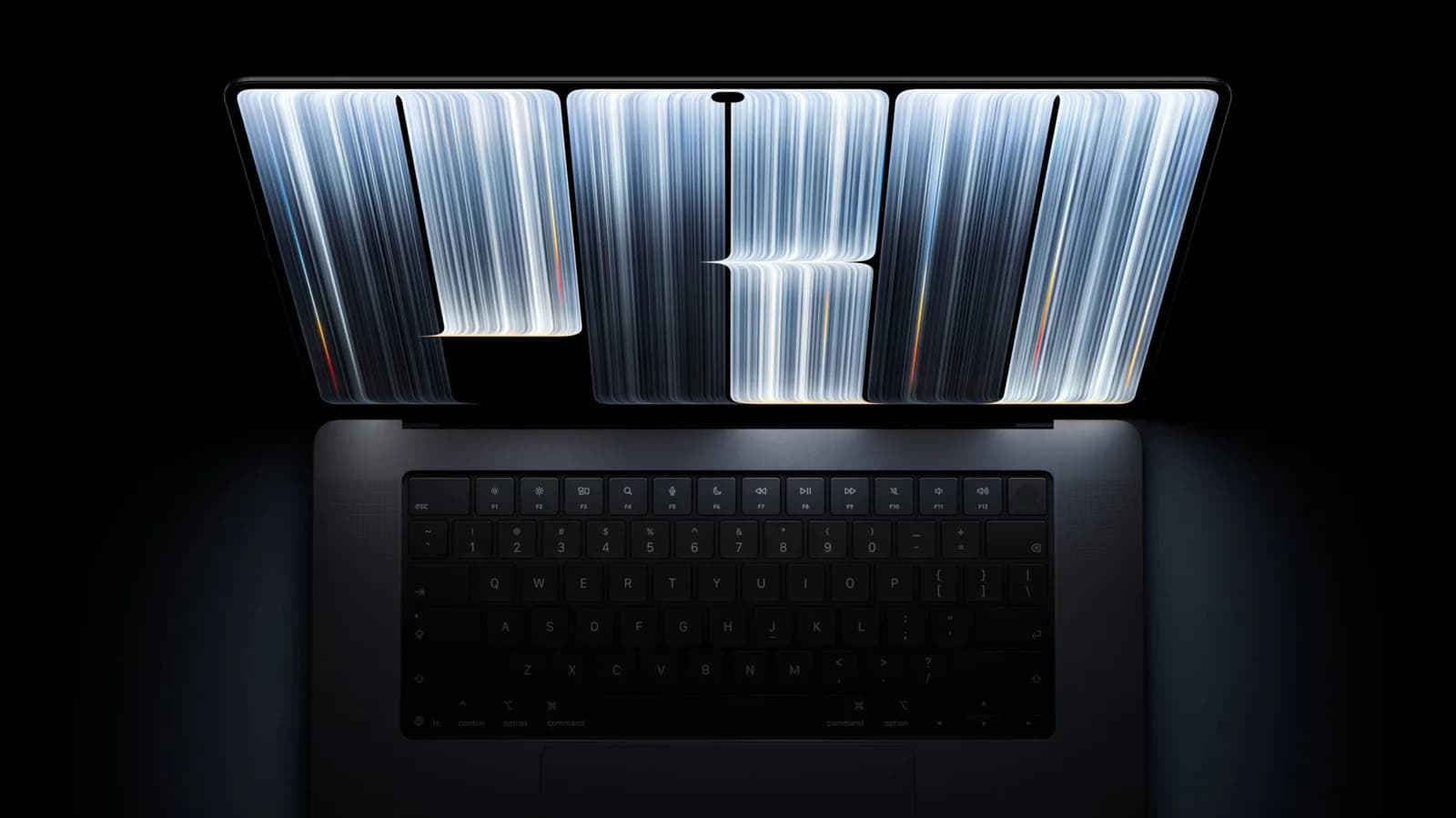Apple's new MacBook Pro with a touchscreen OLED display and Dynamic Island shown open on a desk.